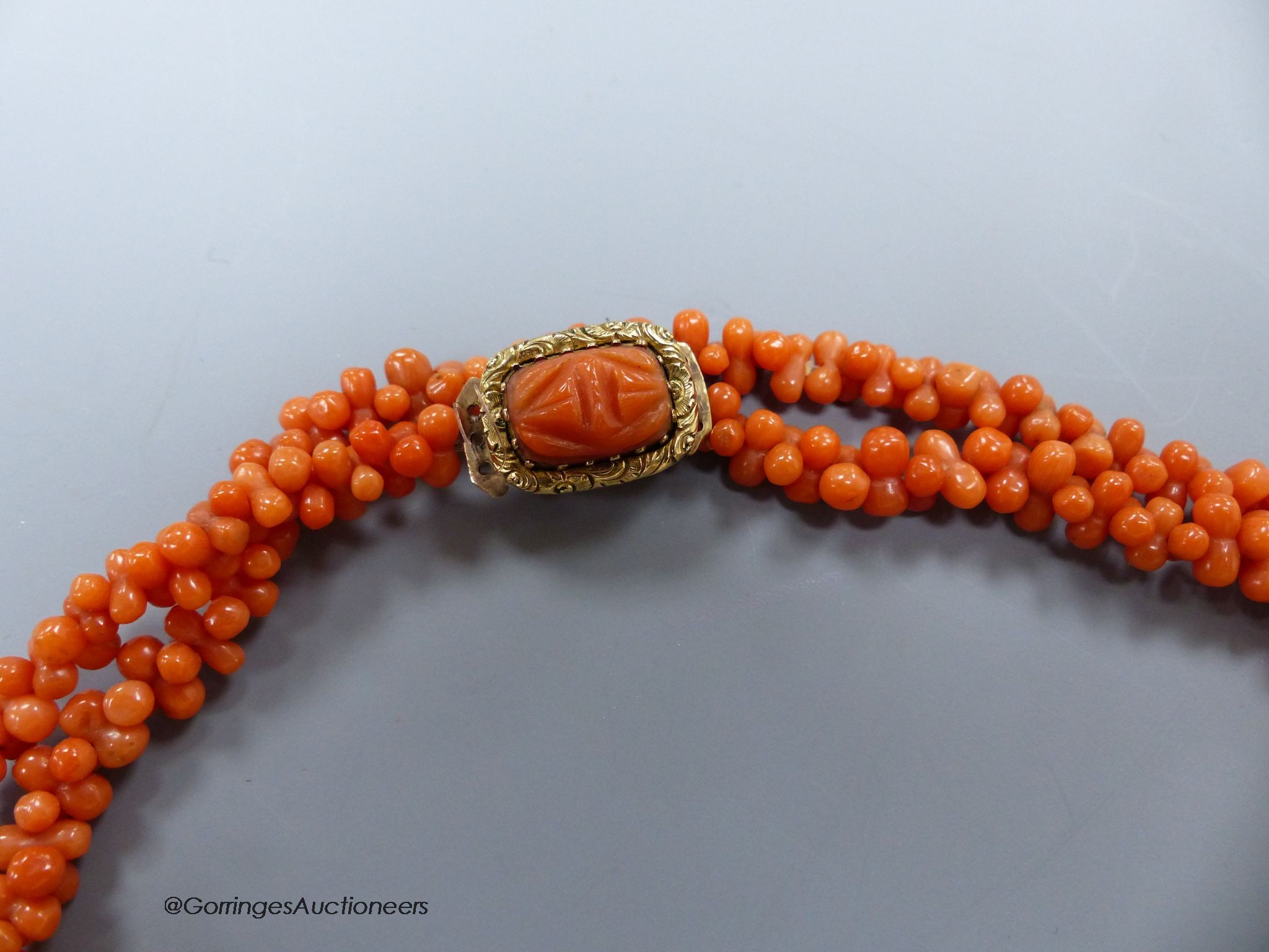 A 19th century coral bead long necklace, with Georgian yellow metal clasp, 92cm.